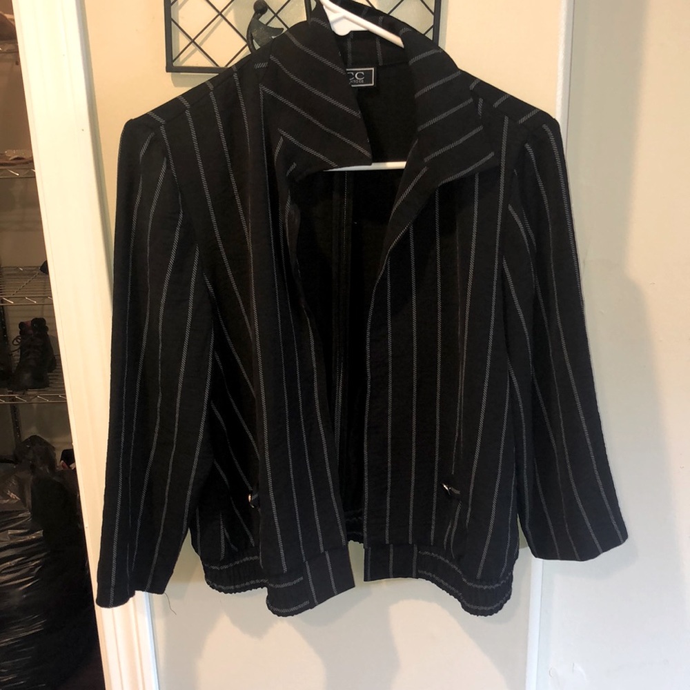 This is an open striped jacket that’s formal fitting and very classsy